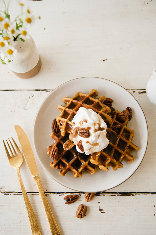 PUMPKIN WAFFLES WITH CANDIED PECANS AND COCONUT WHIPPED CREAM